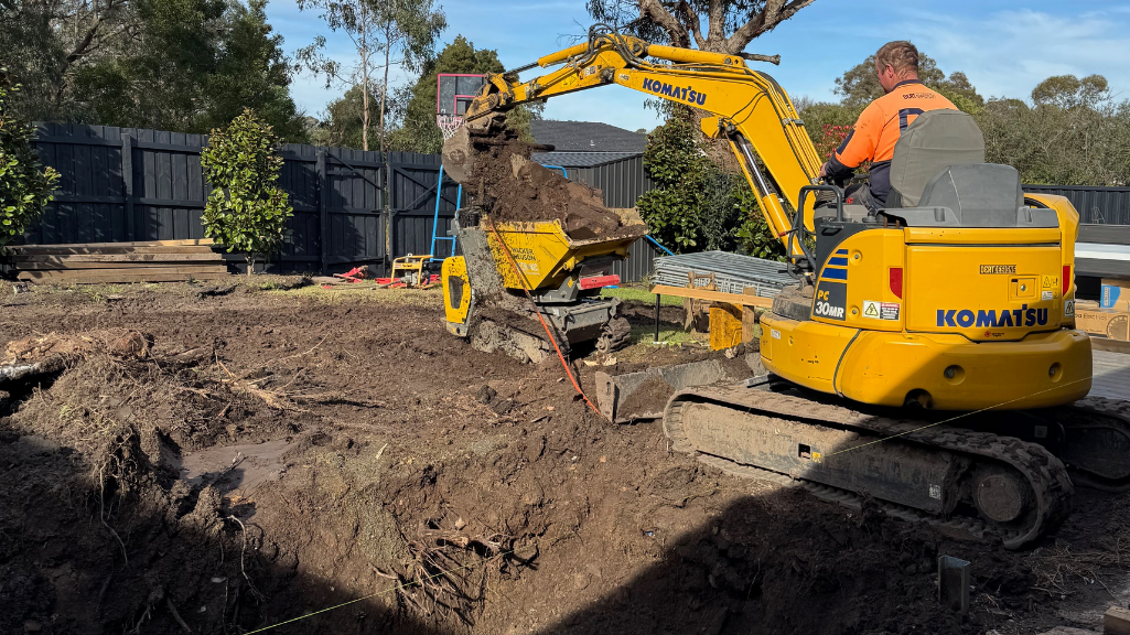 Digger excavating laguna pool site